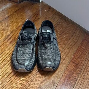 Hey Dude women Black and Tan Sneakers